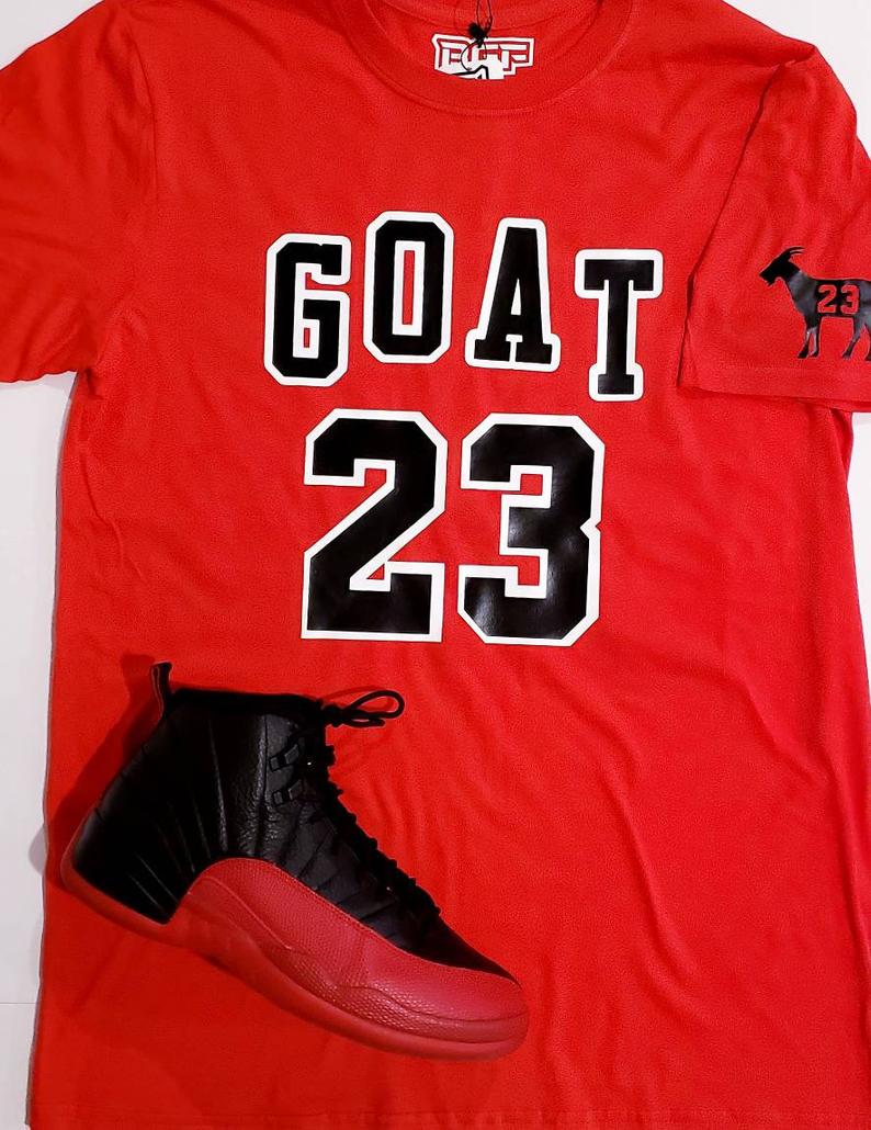 Michael Jordan goat silhouette in Chicago Bulls number 23 jersey and  basketball sneakers on | Essential T-Shirt